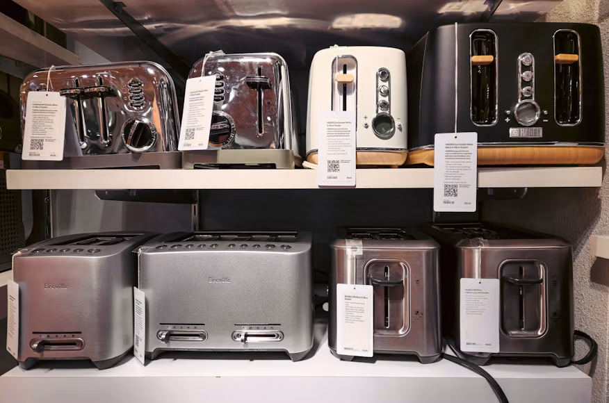 Small kitchen appliances displayed on retail shelves